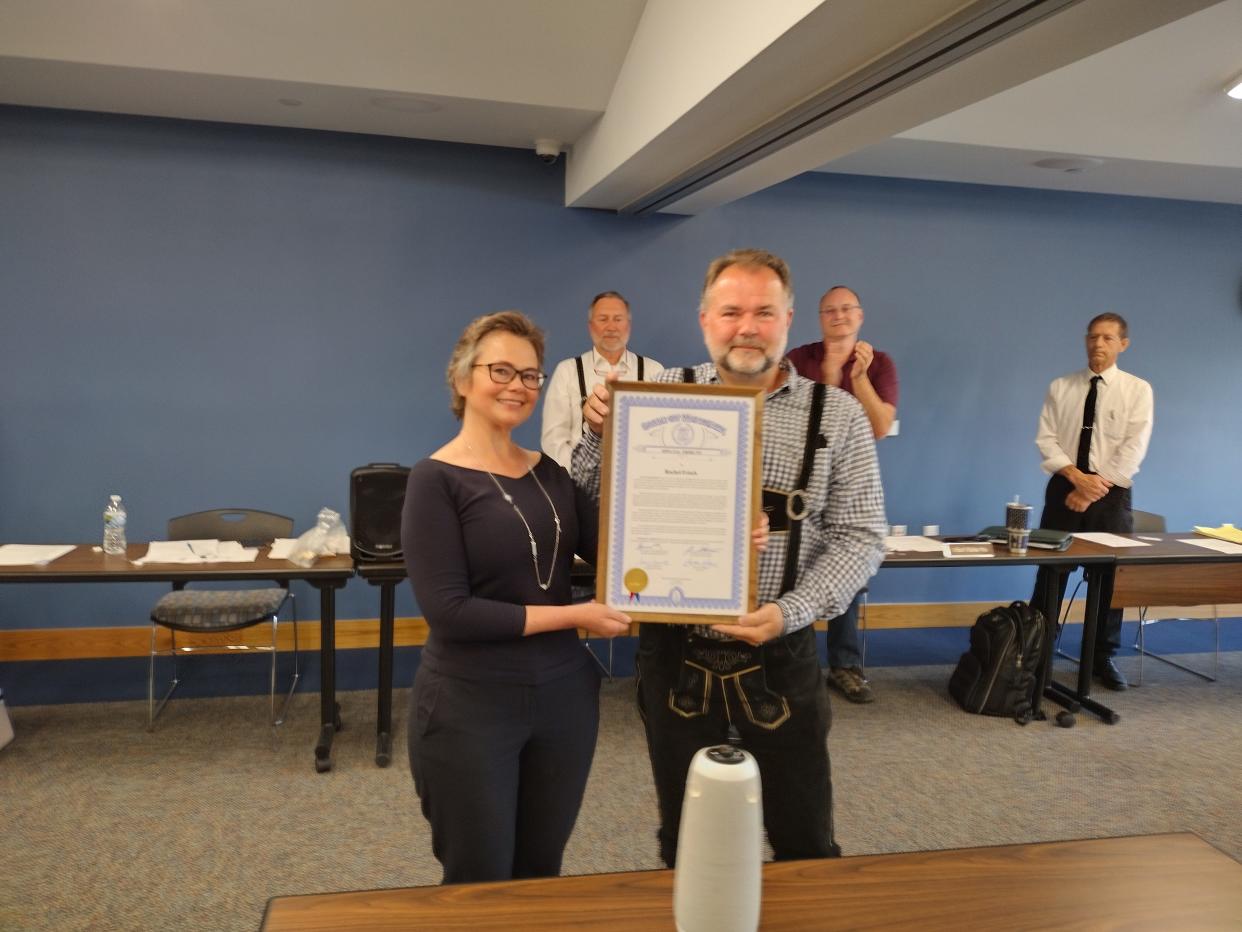 Outgoing Otsego County Administrator Rachel Frisch is presented with a special tribute from the state in her honor by State Rep. Ken Borton (R-Gaylord) at Tuesday's meeting of the Otsego County Board of Commissioners. Frisch is leaving her position on July 15.