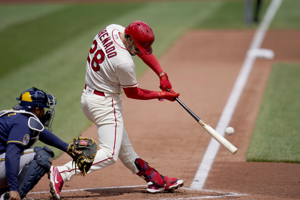 FILE - St. Louis Cardinals' Nolan Arenado doubles down the line during the first inning of a baseball game against the Milwaukee Brewers in St. Louis, in this Saturday, April 10, 2021, file photo. Los Angeles Dodgers pitcher Trevor Bauer is the highest-paid player in 2021 at $38 million after agreeing to a $102 million, three-year contract he can terminate after one season. Los Angeles Angels outfielder Mike Trout is second at $37.1 million, followed by Yankees pitcher Gerrit Cole ($36 million) and St. Louis third baseman Nolan Arenado ($35 million), who was acquired in a trade with Colorado. (AP Photo/Jeff Roberson, File)