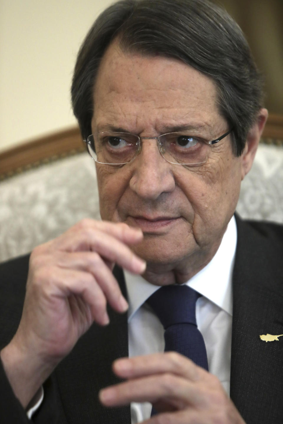 Cyprus' president Nicos Anastasiades talks during an interview with Associate Press at the presidential palace in capital Nicosia, Cyprus, Tuesday Sept. 17, 2019. Anastasiades says Turkey's "obsession" to permanently station troops, secure military intervention rights and extend its influence over Turkish Cypriots in any peace deal is fanning fears that it wants to turn the island into a "protectorate." (AP Photo/Petros Karadjias)