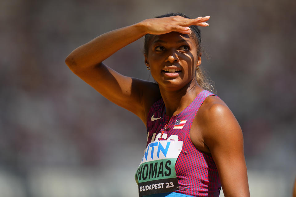 Gabrielle Thomas, of the United States shields her eyes from the sun after finishing a Women's 200-meters heat during the World Athletics Championships in Budapest, Hungary, Wednesday, Aug. 23, 2023. (AP Photo/Petr David Josek)