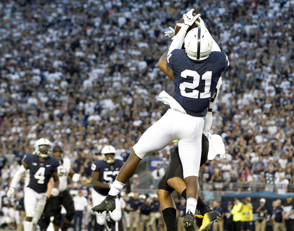 Penn State's Amani Oruwariye (21) intercepts a pass intended for Appalachian State's Corey Sutton (2) in the end zone during overtime of an NCAA college football game in State College, Pa., Saturday, Sept. 1, 2018. Penn State won 45-38 in OT. (AP Photo/Chris Knight)