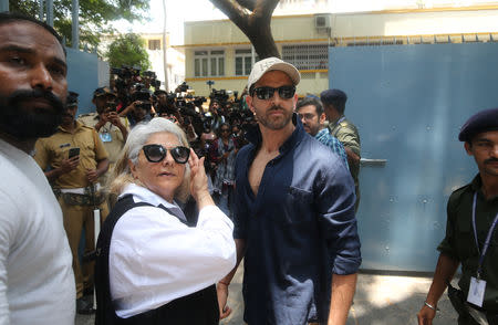 Bollywood actor Hrithik Roshan and his mother Pinky Roshan leave after casting their votes at a polling station in Mumbai, India April 29, 2019. REUTERS/Francis Mascarenhas