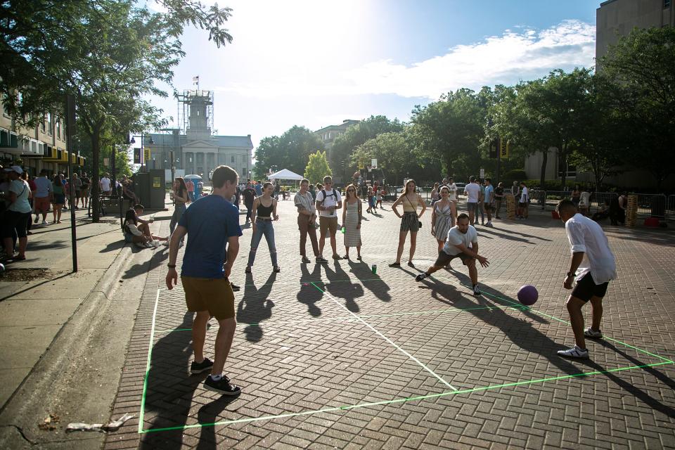 A competitive game of foursquare takes place on Iowa Avenue during the fifth Downtown Block Party, Saturday, June 25, 2022, in Iowa City, Iowa.