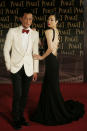 Hong Kong actor Louis Koo and actress Sammi Cheng pose on the red carpet of the 33rd Hong Kong Film Awards in Hong Kong Sunday, April 13, 2014. (AP Photo/Vincent Yu)