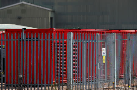 FILE PHOTO: A row of red-painted containers at the Lochaber aluminium smelter site, which is owned by companies controlled by Sanjeev Gupta's GFG Alliance, in Fort William, Scotland, Britain April 17, 2019. REUTERS/Russell Cheyne/File Photo