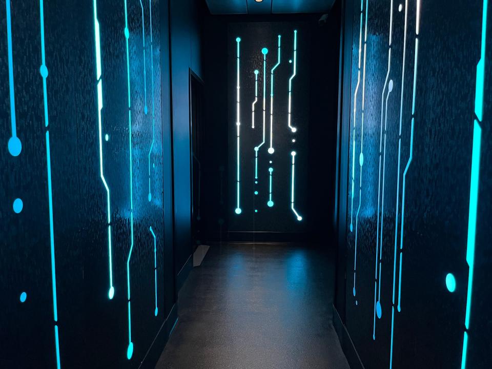 entry hallway inside the queue for tron roller coaster at magic kingdom