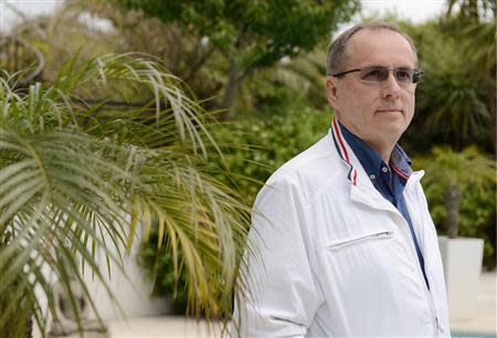 Russian businessman Sergei Kolesnikov poses for a photograph at a hotel in Antibes, April 19, 2014. Picture taken April 19, 2014. REUTERS/Jean-Pierre Amet