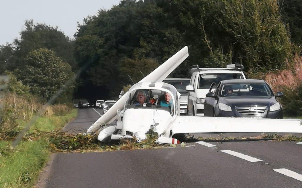 The light aircraft came to rest on a busy Gloucestershire road