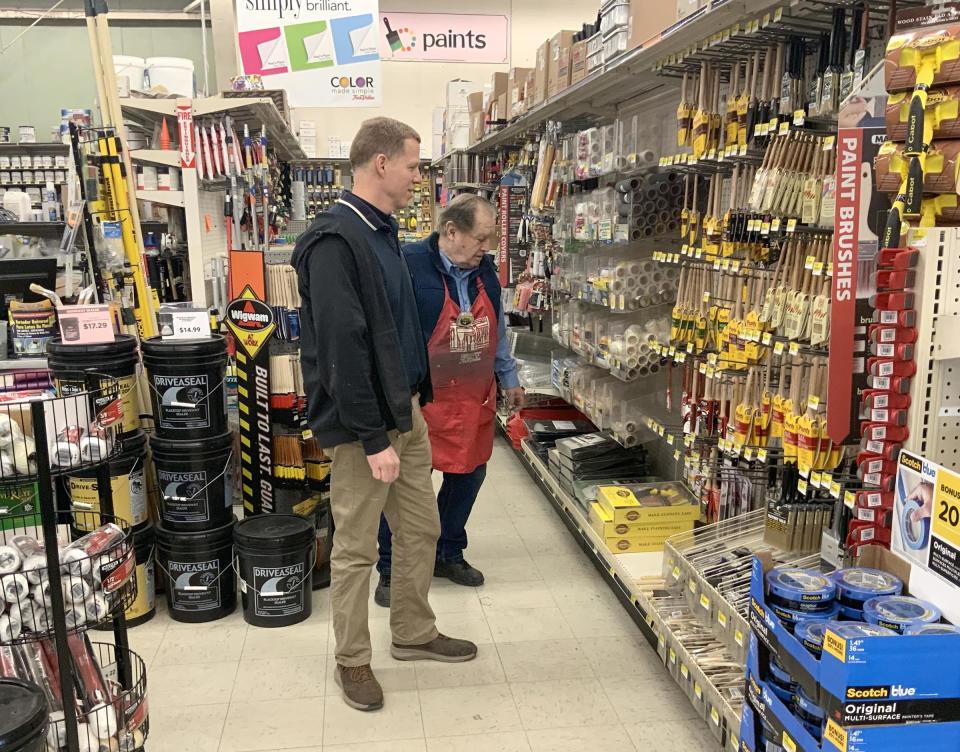 Chris Loranger, left, co-owner of the 1 Stop Building Supply Center True Value in Newport, checks inventory with employee Larry Faust in 2020.