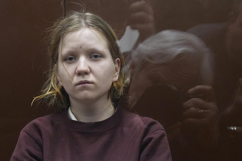 Darya Trepova, a 26-year-old St. Petersburg resident suspected of involvement in a bombing at a St. Petersburg cafe, sits in a cage in the courtroom prior to a court session in the Basmanny District Court, in Moscow, Russia, Tuesday, April 4, 2023. (AP Photo/Alexander Zemlianichenko)