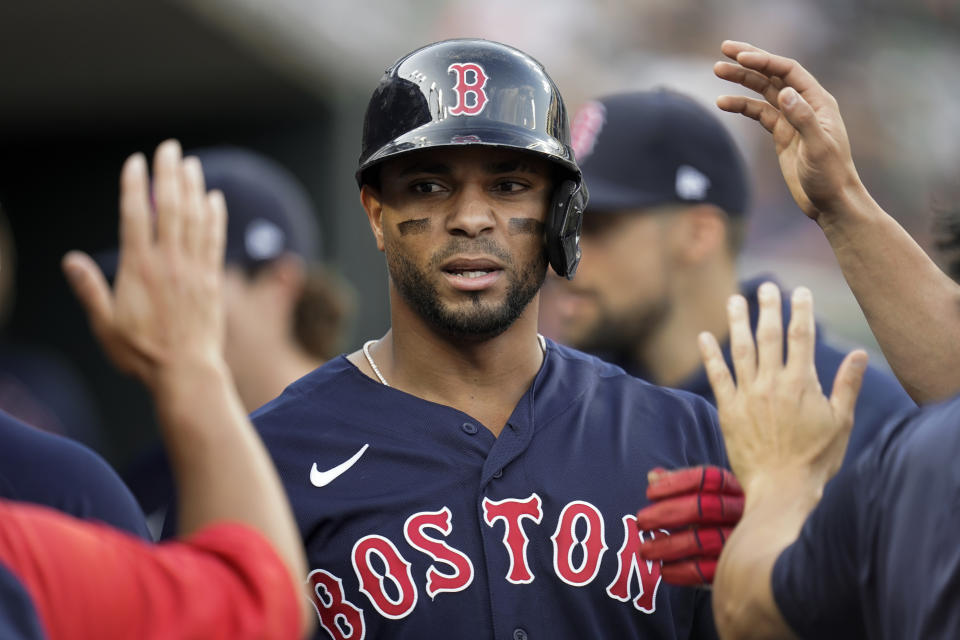 Boston Red Sox's Xander Bogaerts celebrates scoring against the Detroit Tigers in the first inning of a baseball game in Detroit, Tuesday, Aug. 3, 2021. (AP Photo/Paul Sancya)