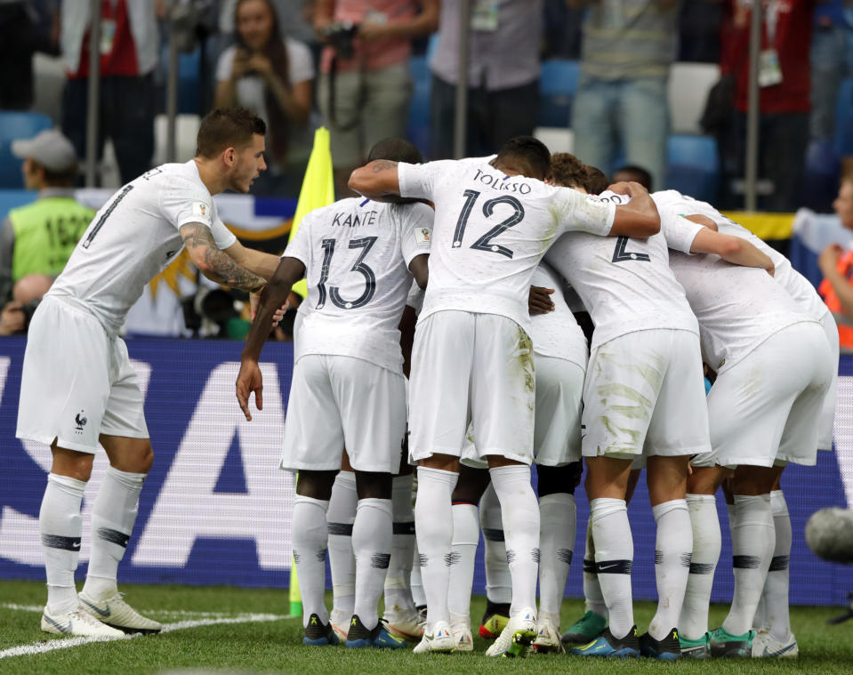 France’s Raphael Varane celebrates with teammates after scoring his side’s opening goal during the quarterfinal match between Uruguay and France at the 2018 soccer World Cup in the Nizhny Novgorod Stadium, in Nizhny Novgorod, Russia, Friday, July 6, 2018. (AP Photo/Ricardo Mazalan)