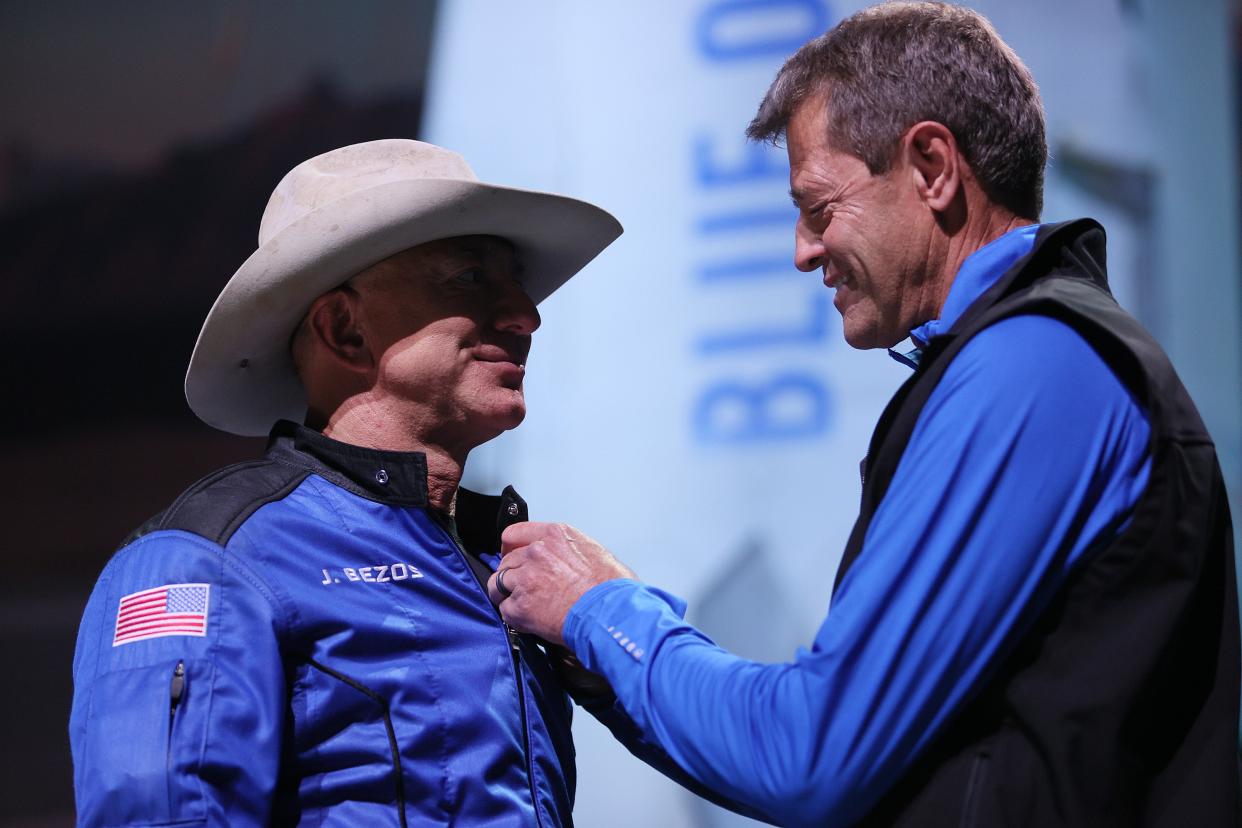 Jeff Bezos receives astronaut wings from Blue Origin’s Jeff Ashby, a former Space Shuttle commander (Getty Images)