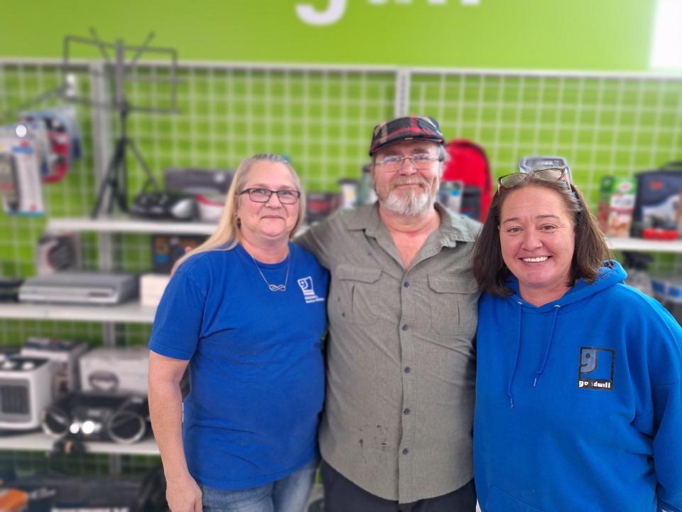 From left, Cheryl Kobylinski of Gaylord, Kevin Arnold of Gaylord and Jessica Butler of Elmira, at the new Goodwill store on West Main Street in Gaylord. All three were in the old store when it was damaged by a tornado on May 20, 2022.