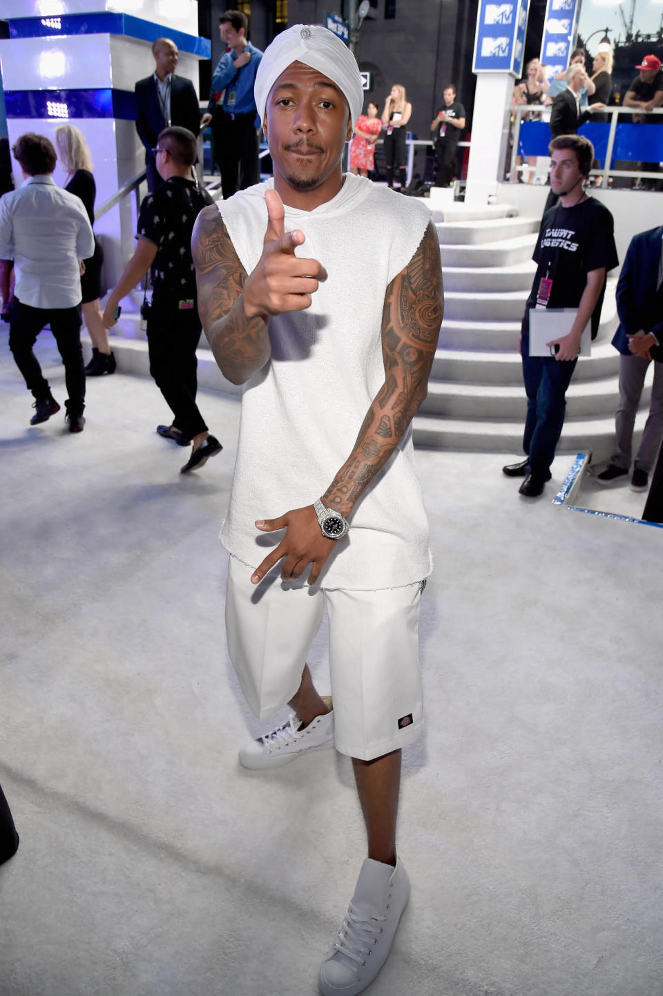 Nick Cannon in a head-to-toe white ensemble. 