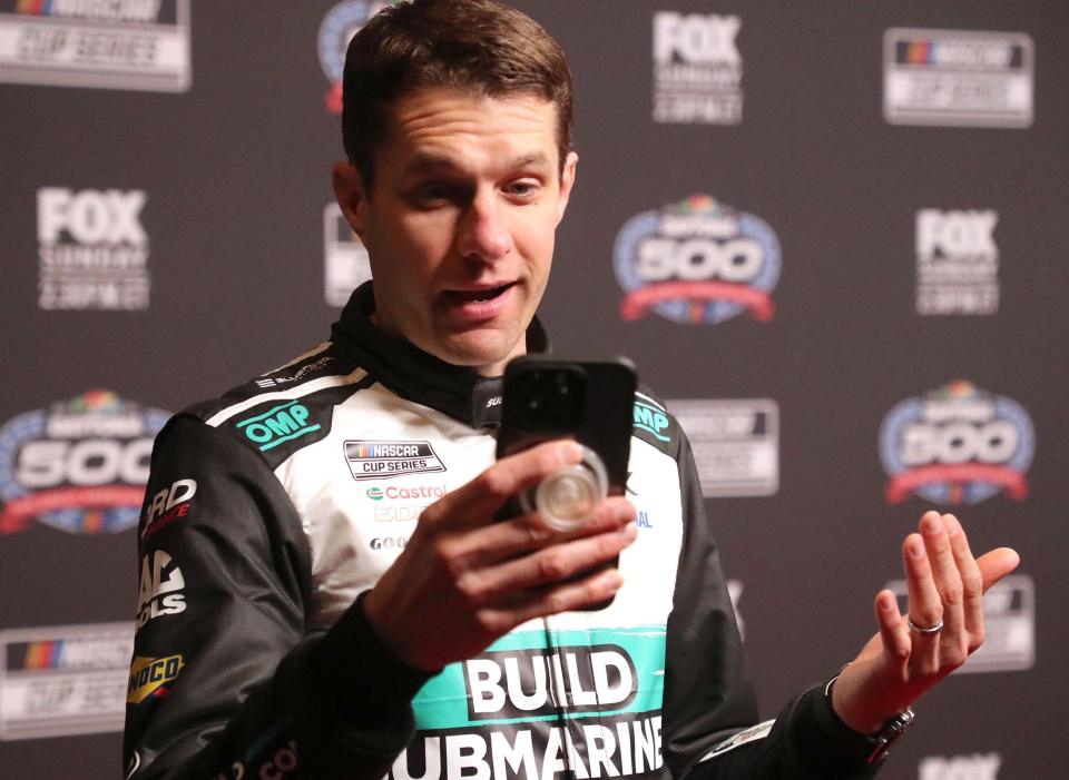 David Ragan records a social media hit on the Red Carpet, Wednesday February 14, 2024 during Daytona 500 Media Day at Daytona International Speedway