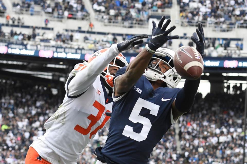 Illinois defensive back Devon Witherspoon breaks up a pass intended for Penn State receiver Jahan Dotson, Oct. 23, 2021.