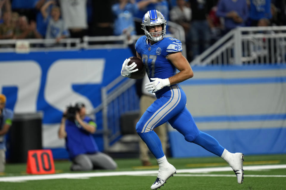 Detroit Lions tight end Sam LaPorta scores a touchdown on a 45-yard pass reception against the Atlanta Falcons in the first half of an NFL football game Sunday, Sept. 24, 2023, in Detroit. (AP Photo/Paul Sancya)