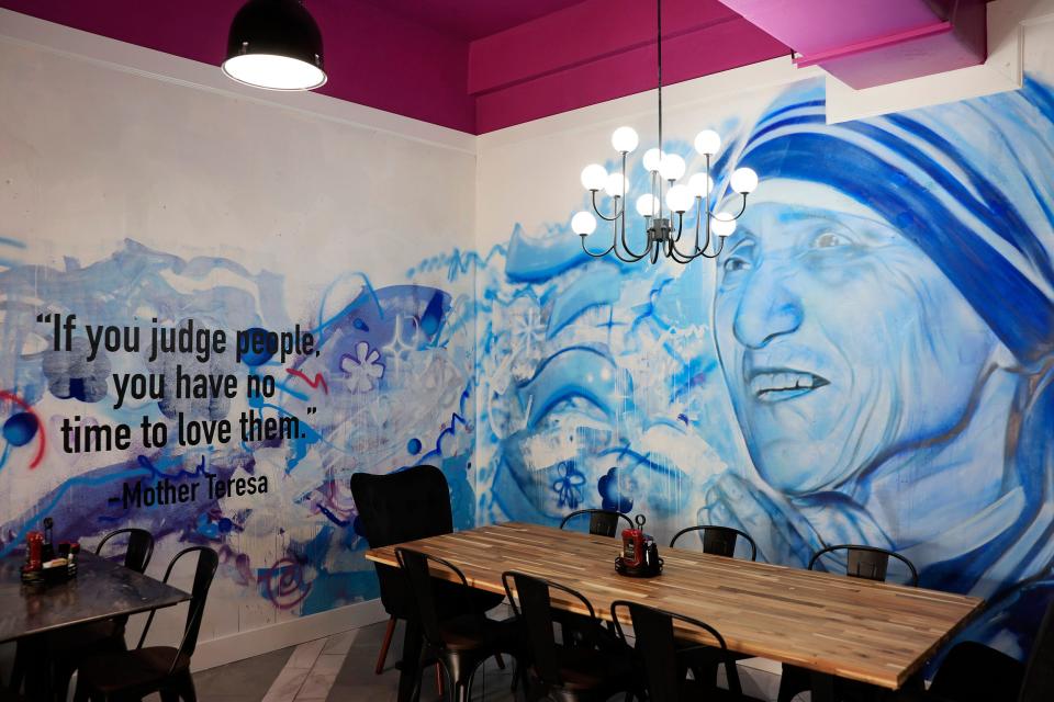 A mural of Mother Teresa is one of several by Florida artist Nicole “Nico” Holderbaum on the walls at newly opened Tulua Bistro in historic Springfield.