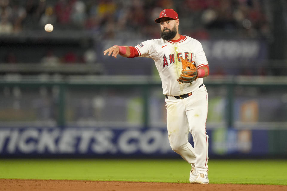 Los Angeles Angels shortstop Luis Guillorme throws out Texas Rangers' Jonah Heim at first during the seventh inning of a baseball game, Monday, July 8, 2024, in Anaheim, Calif. (AP Photo/Ryan Sun)