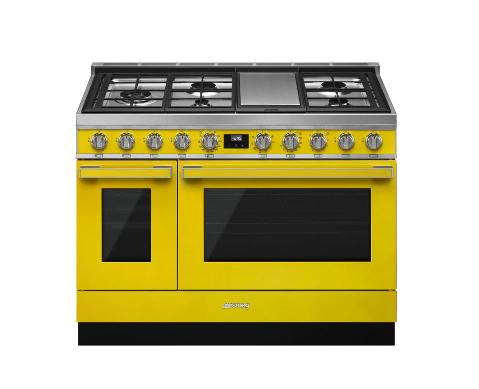 This photo provided by SMEG USA shows one of their yellow ranges. If you're keen to take a bigger leap into yellow beyond just paint or accessories, consider appliances. SMEG has a suite of stoves, range hoods and fridges in the hue; paired with neutral colors, stone and wood, the look is upbeat and uber cool. (SMEG USA via AP)