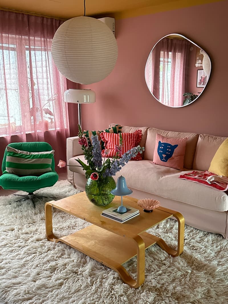 Paper pendant lanterns on a coffee table in a colorful living room.