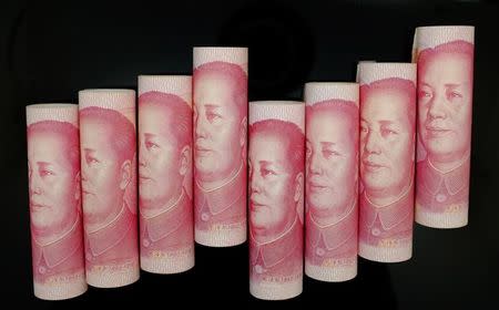 100 Yuan notes are seen in this illustration picture in Beijing November 5, 2013. REUTERS/Jason Lee/Files