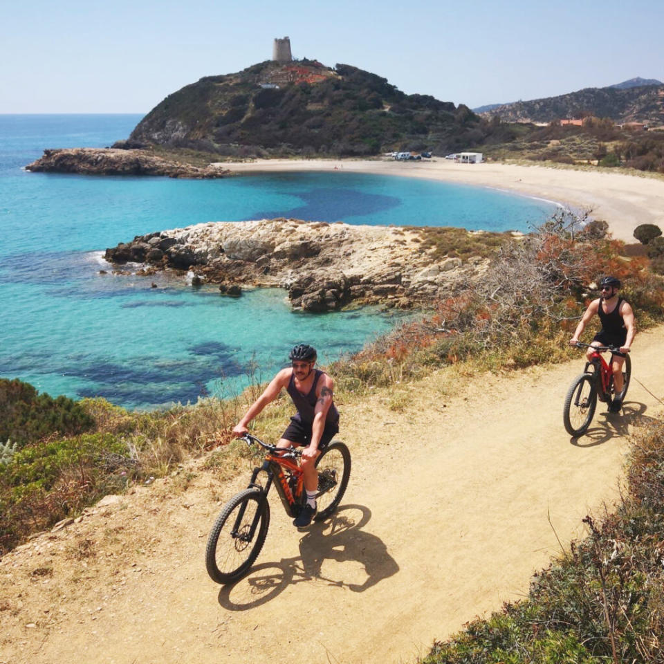 Writer Cliff (far right) cycling with his boyfriend (Image: Provided)