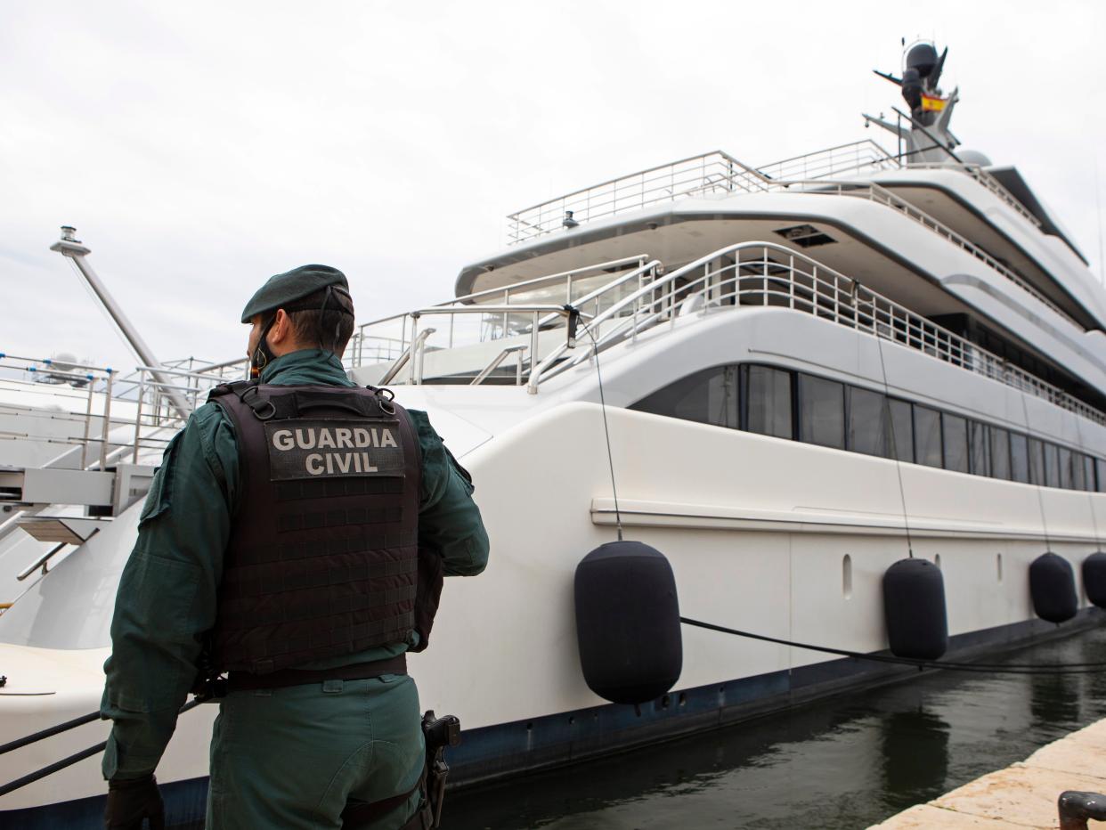 A Civil Guard stands by the yacht called Tango in Palma de Mallorca, Spain, Monday April 4, 2022