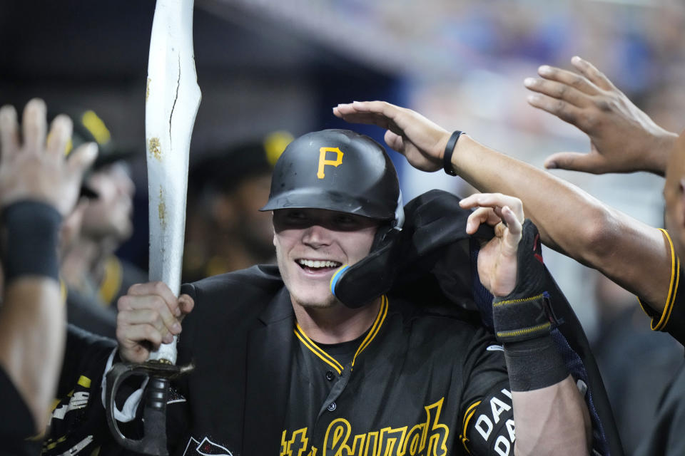 Pittsburgh Pirates' Henry Davis is congratulated by teammates after he hit a home run during the eighth inning of a baseball game against the Miami Marlins, Thursday, June 22, 2023, in Miami. (AP Photo/Wilfredo Lee)