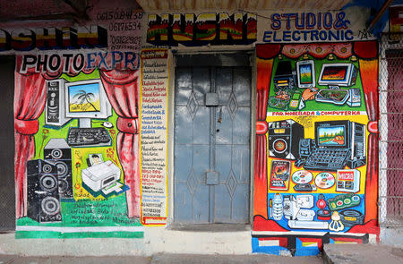 A mural on a shop front illustrates electrical appliances in Wabari district of Mogadishu, Somalia, June 8, 2017. REUTERS/Feisal Omar