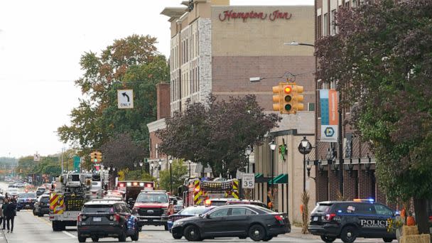 PHOTO: Police vehicles are parked outside the Hampton Inn in Dearborn, Mich., Oct. 6, 2022. (Paul Sancya/AP)