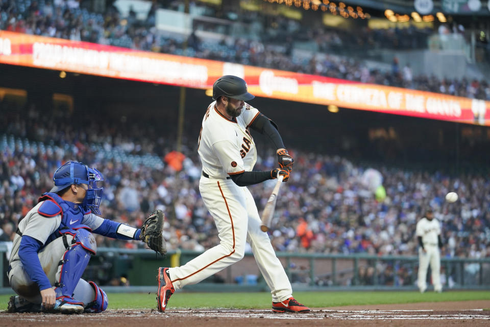 San Francisco Giants' Darin Ruf hits an RBI double against the Los Angeles Dodgers during the first inning of a baseball game in San Francisco, Wednesday, April 12, 2023. (AP Photo/Godofredo A. Vásquez)