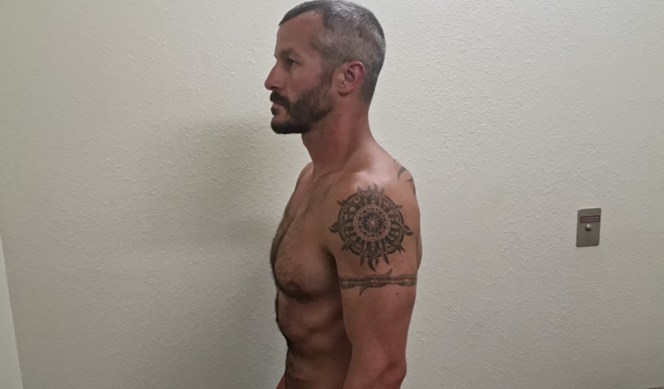 Chris Watts is seen shirtless in prison.