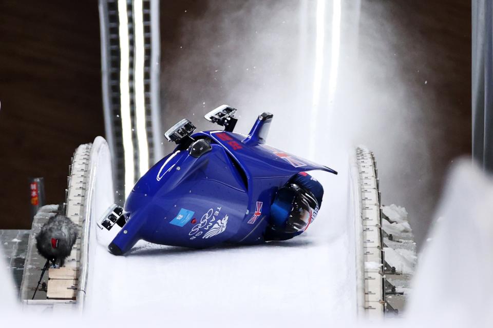 Brad Hall and Nick Gleeson of Team Great Britain crash during the 2-man Bobsleigh Heat 3 (Getty Images)