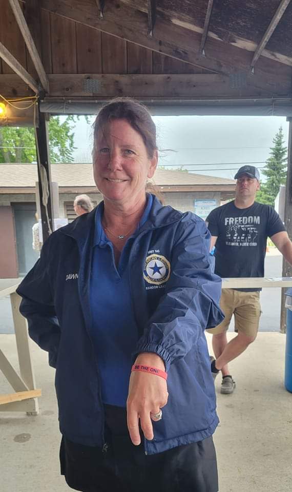Dawn Anderson, Random Lake Auxiliary 145 Vice President, wears a Be the One wristband at a local festival.