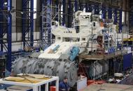 Employees of Soil Machine Dynamics (SMD) work on a subsea mining machine being built for Nautilus Minerals at Wallsend, northern England April 14, 2014. REUTERS/ Nigel Roddis