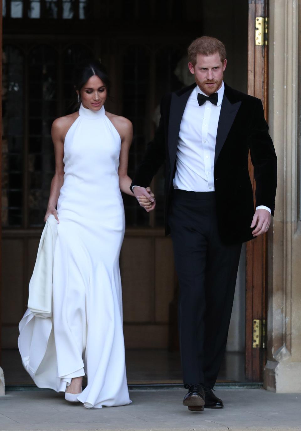 <p>Like many other royal brides, Meghan Markle changed into a second wedding dress to attend her wedding reception when she married Prince Harry in May 2018. The Duchess changed into a bespoke <a href="https://www.townandcountrymag.com/society/tradition/a20759645/meghan-markle-royal-wedding-reception-dress-photos/" rel="nofollow noopener" target="_blank" data-ylk="slk:lily white gown by Stella McCartney;elm:context_link;itc:0;sec:content-canvas" class="link ">lily white gown by Stella McCartney</a> featuring a high neck.</p>