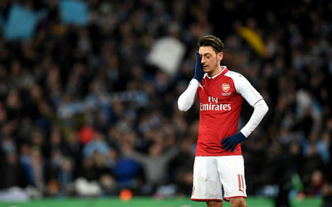 Mesut Ozil reacts at Wembley - Credit: PA