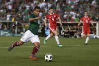 May 28, 2018; Los Angeles , Los Angeles, CA, USA; Mexico midfielder Giovani Dos Santos (10) attempts a shot against Wales during the second half at the Rose Bowl. Kelvin Kuo-USA TODAY Sports