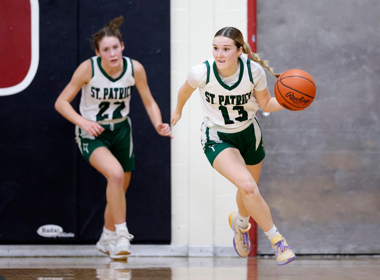 Portland St. Patrick's Laynie Meredith, right, brings the ball up court as Rylee Scheurer trails against Fowler, Friday, Feb. 2, 2024, in Portland.