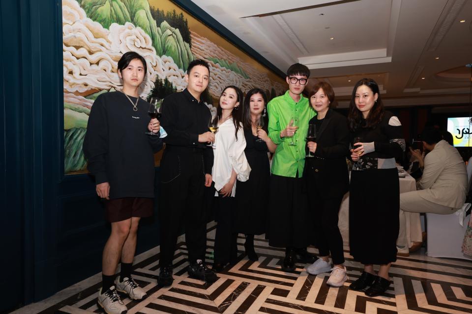 From left: designers Wei Ge, Zhang Aoyu, Chen Danqi, Huang Wanbing, Madame Lv, secretary general of Shanghai Fashion Week, and designer Guo Yirantian. - Credit: Courtesy