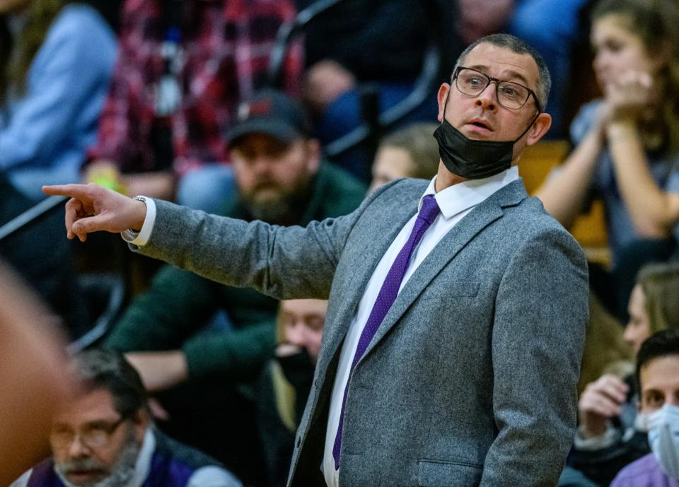 El Paso-Gridley head coach Nathaniel Meiss gives some direction to his players as they battle Eureka in the first half Friday, Jan. 7, 2022 at Eureka High School. The Hornets fell to the Titans 55-46.