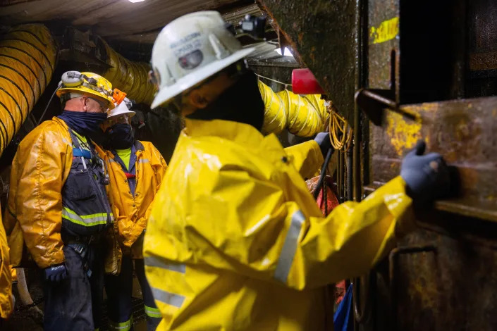 Mine workers wait for the mine shaft lift while 6780 ft underground in the Resolution Copper exploratory mine shaft in Superior, Arizona, March 30, 2021. REUTERS/Caitlin O'Hara