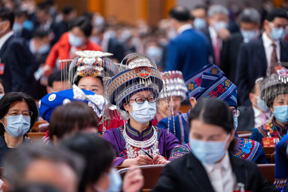 Deputies to the 14th National People's Congress (NPC) attend the opening meeting