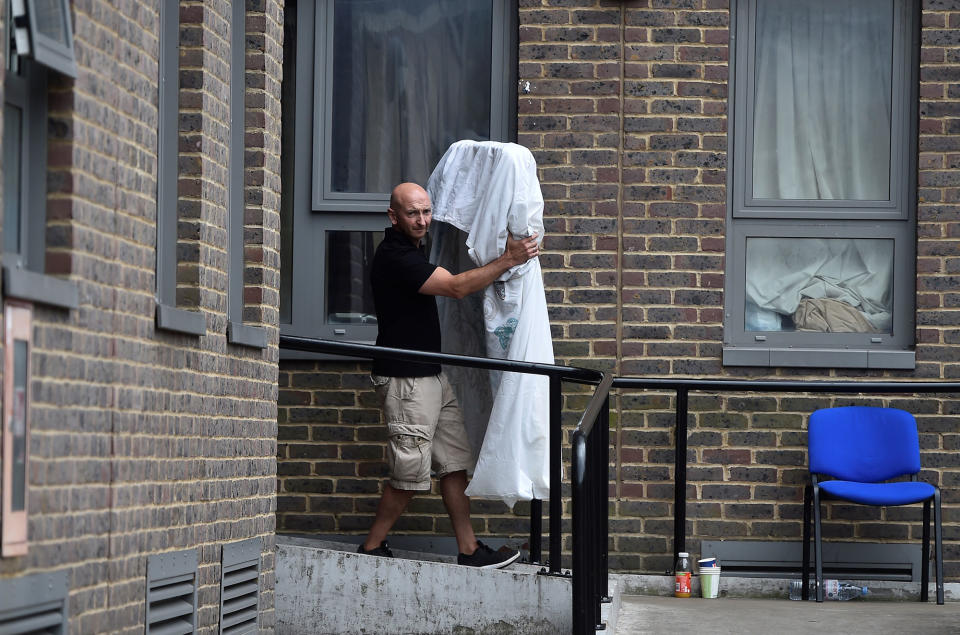 A man carries a mattress from the Dorney Tower