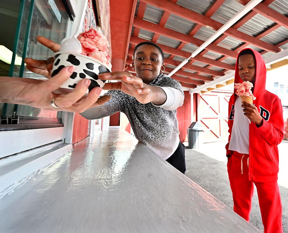 Daniel Amoah and his cousin, Jason Brempong, right, each got cherry during a family outing to Gibby's Famous Ice Cream on Sunderland Road.