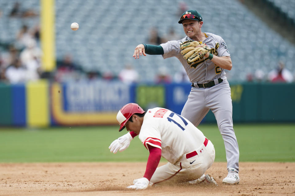 Oakland Athletics' Nick Allen throws to first base after forcing out Los Angeles Angels' Shohei Ohtani during the fifth inning of a baseball game Thursday, Aug. 4, 2022, in Anaheim, Calif. Luis Rengifo was safe at first. (AP Photo/Jae C. Hong)