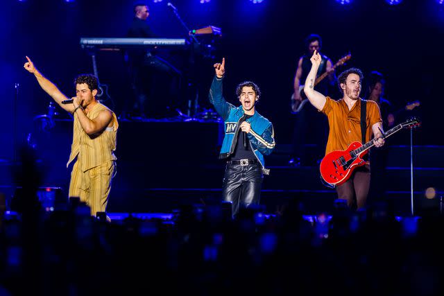 <p>Mauricio Santana/Getty </p> Jonas Brothers performing in Brazil on April 16, 2024