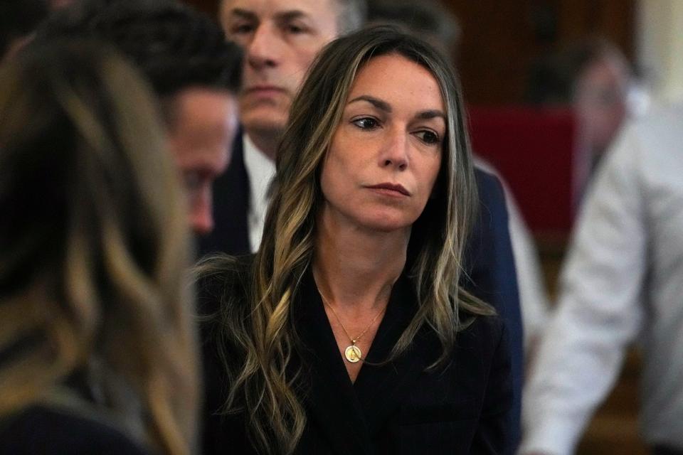 Karen Read stands as jurors depart the court to continue with deliberations at the trial of Read at Norfolk Superior Court, Friday, June 28, 2024, in Dedham, Mass. Read, 44, is accused of running into her Boston police officer boyfriend with her SUV in the middle of a nor'easter and leaving him for dead after a night of heavy drinking. (AP Photo/Charles Krupa, Pool)